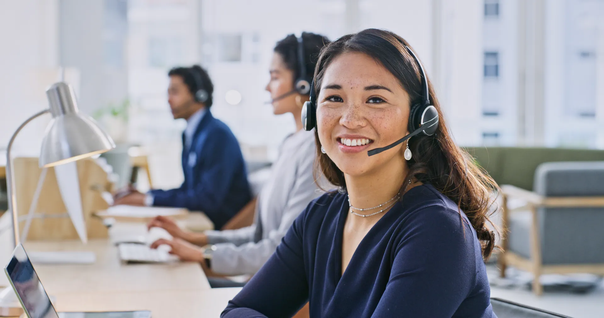 JJ_Photo_Call-center-associate-smiling-on-call_GettyImages_1833005811.jpg